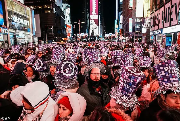 Thousands Gather in Times Square for New Year's Eve Ball Drop Amid Chilly Conditions
