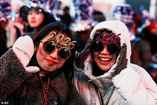 Thousands Gather in Times Square for New Year's Eve Ball Drop Amid Chilly Conditions