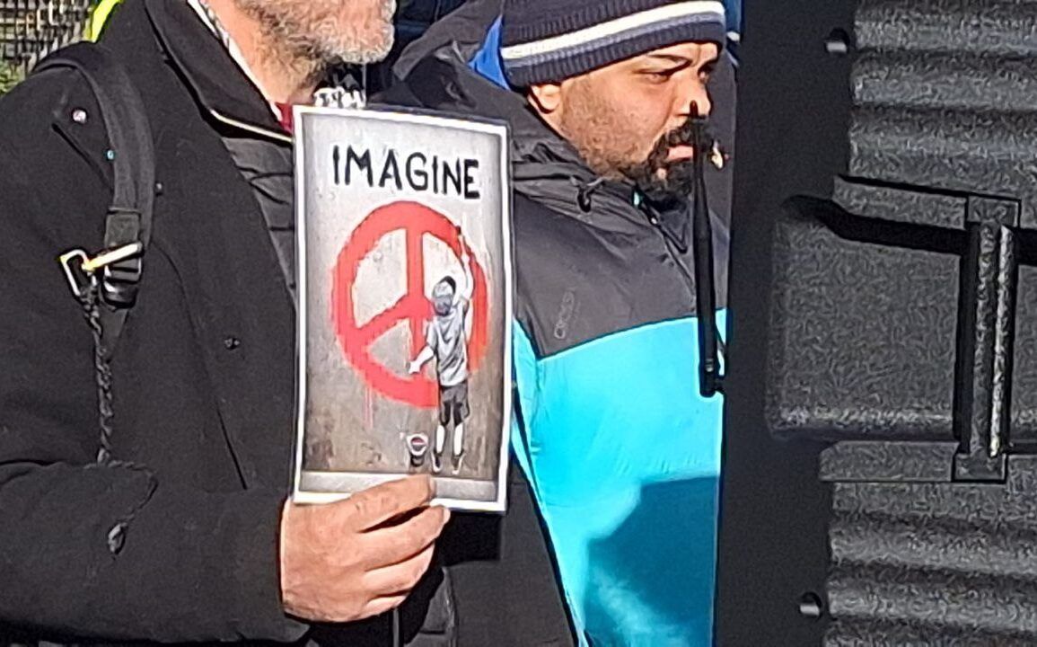 Truth & Neutrality Alliance Celebrates Second Anniversary with Protest